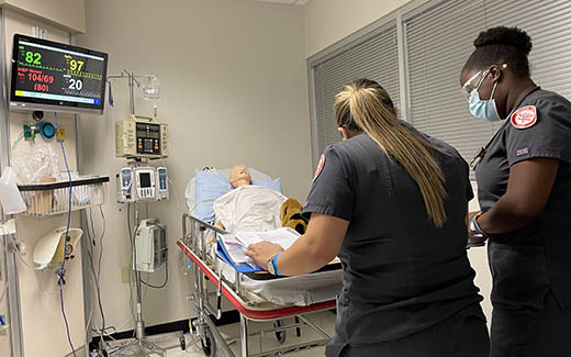 UNT Nursing students practicing in a training hospital environment