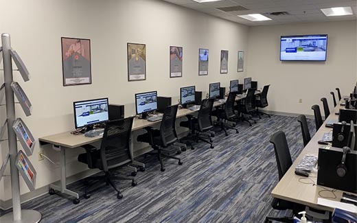 The new grayson career center, featuring rows of computers with posters featuring the shchool's 6 pathways