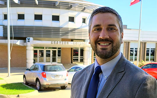 Corey Leird in front of Student Affairs Building